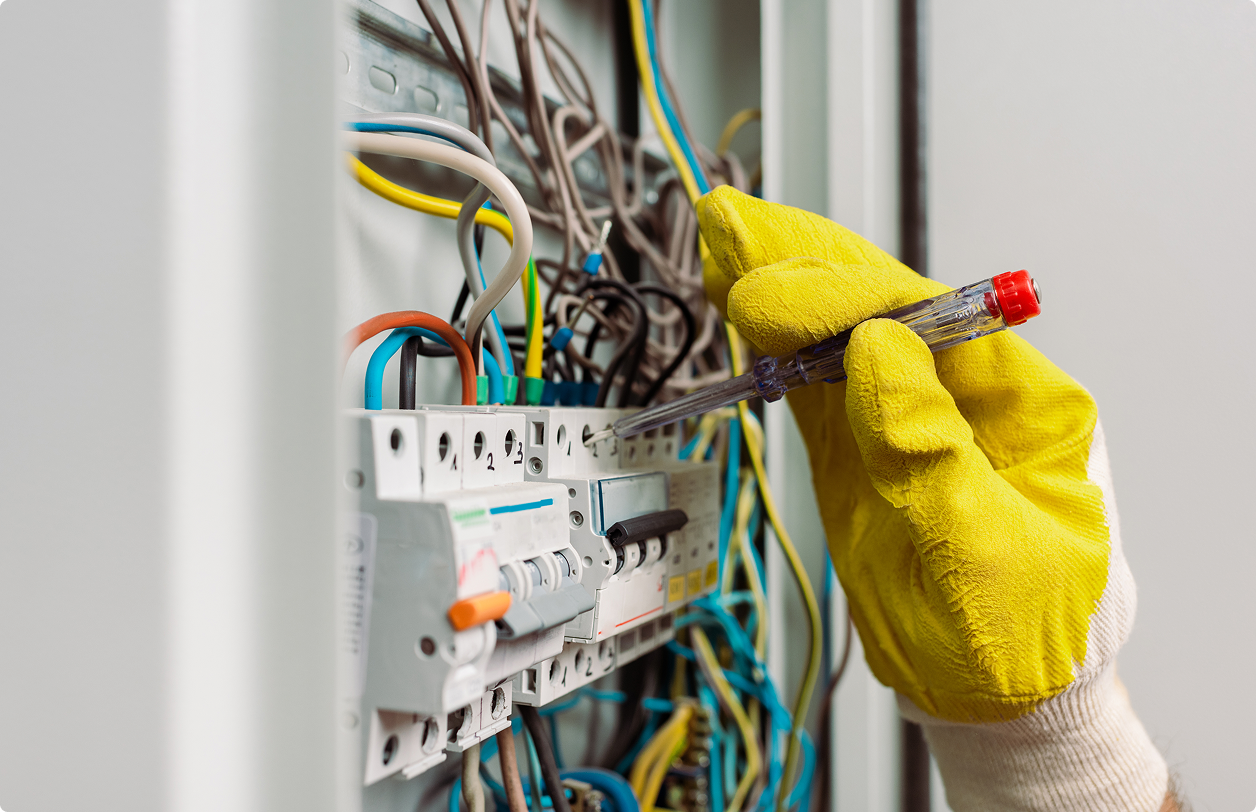 Veteran Air Electrician Repairing Electrical Panel Circuit Breakers In Sarasota