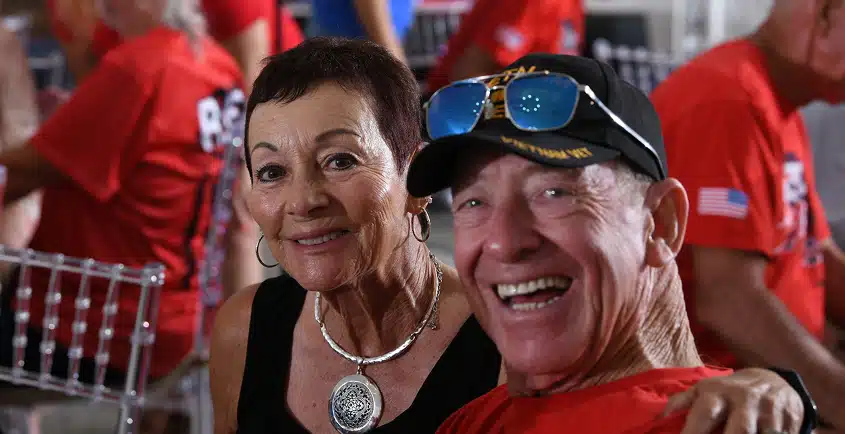Veteran and supporter smiling at a Southwest Florida Honor Flight reunion
