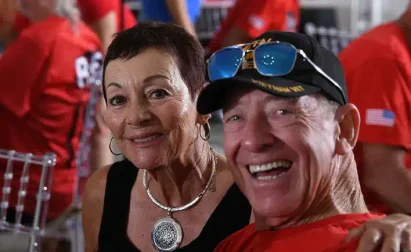 Veteran and supporter smiling at a Southwest Florida Honor Flight reunion